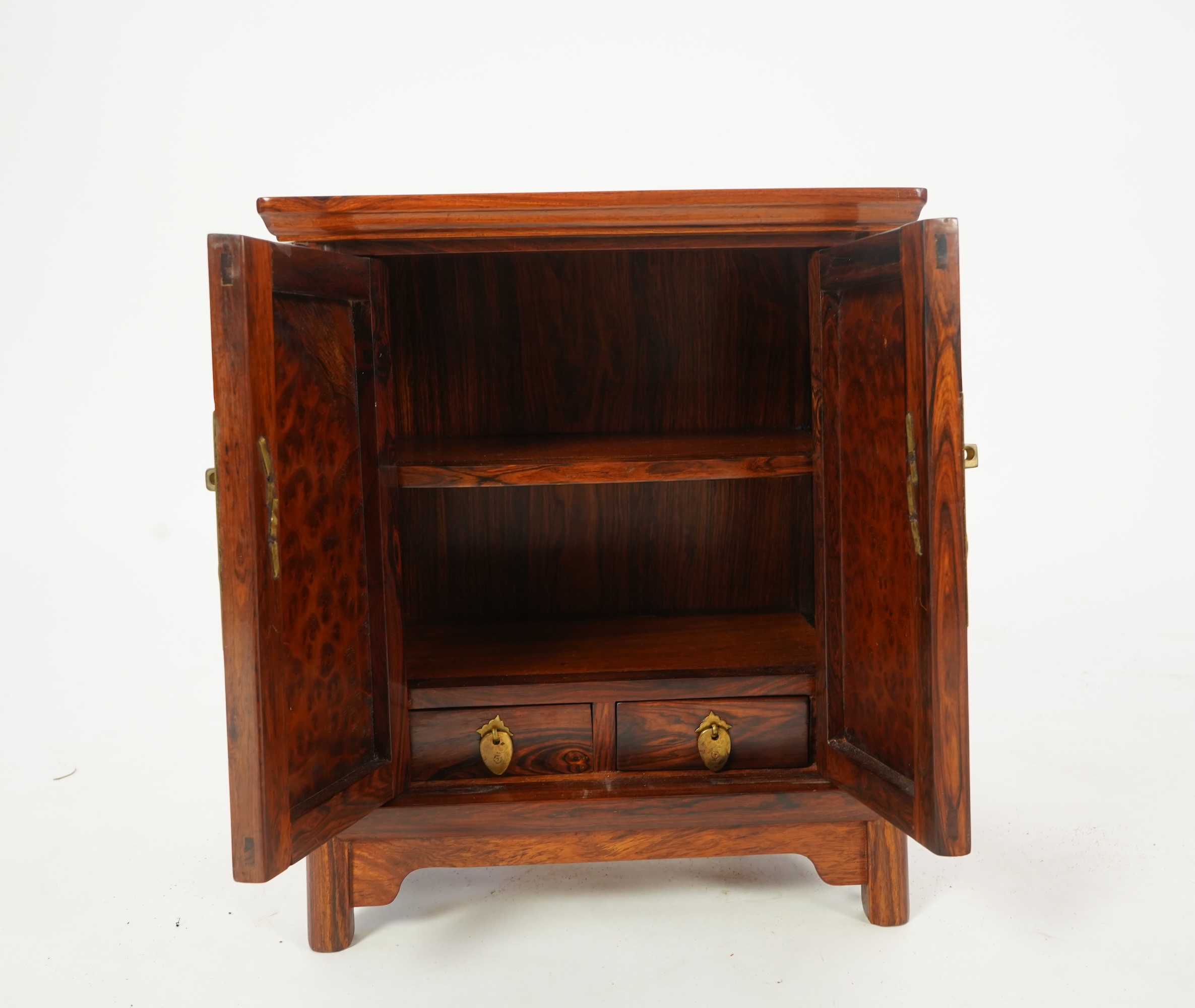 A Chinese huanghuali and burrwood panelled round-corner kang cabinet, 20th century